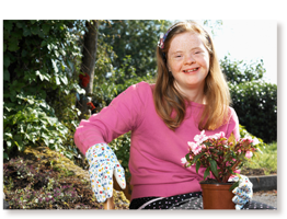 young woman with Down syndrome gardening